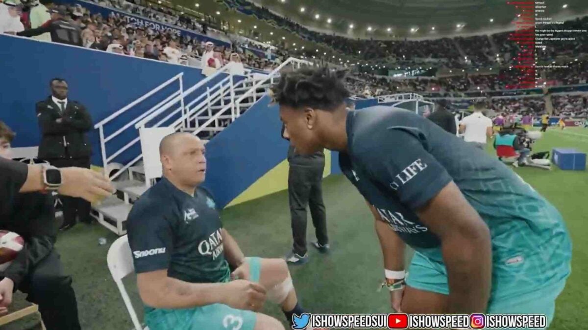 Roberto Carlos blessing IShowSpeed with good luck after the streamer kissed his legs before the Match for Hope charity football game