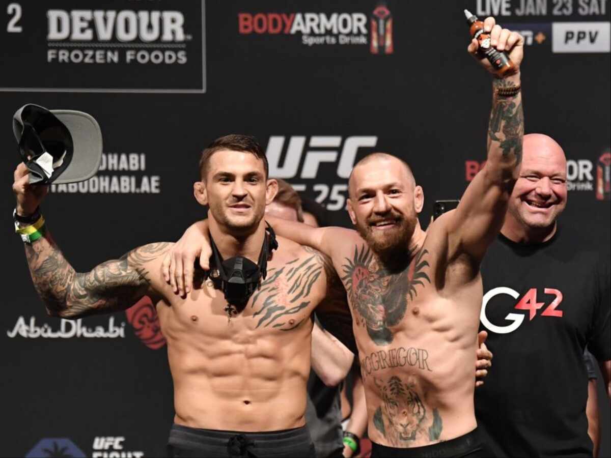 Conor McGregor holding Dustin Poirier's hot sauce