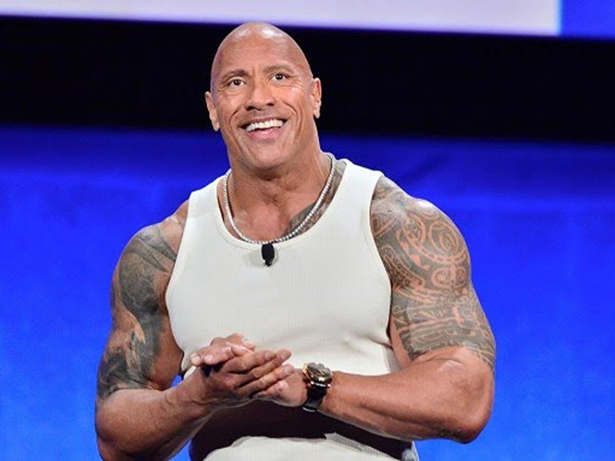 The Rock officially confirms that former World Champion has re-signed with WWE