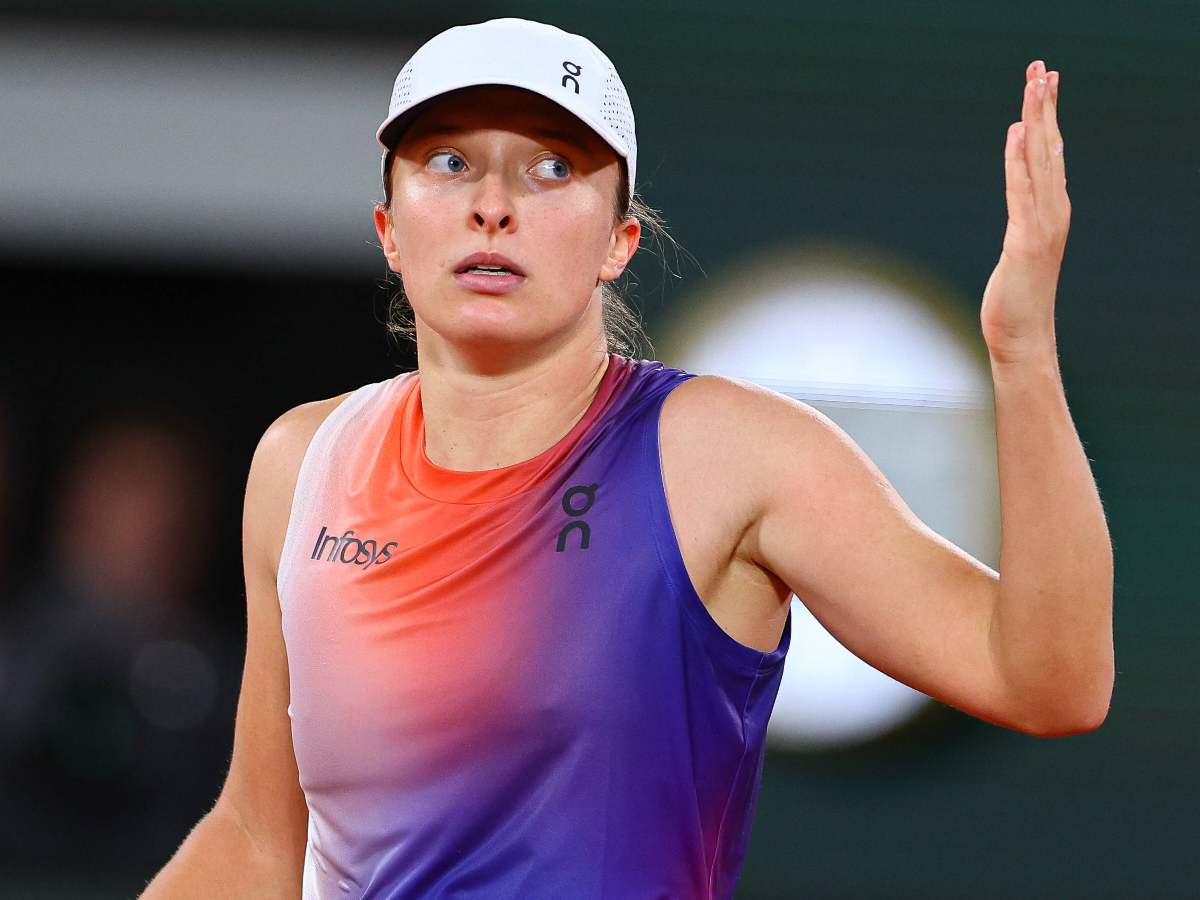 Iga Swiatek reacts during her match against Naomi Osaka