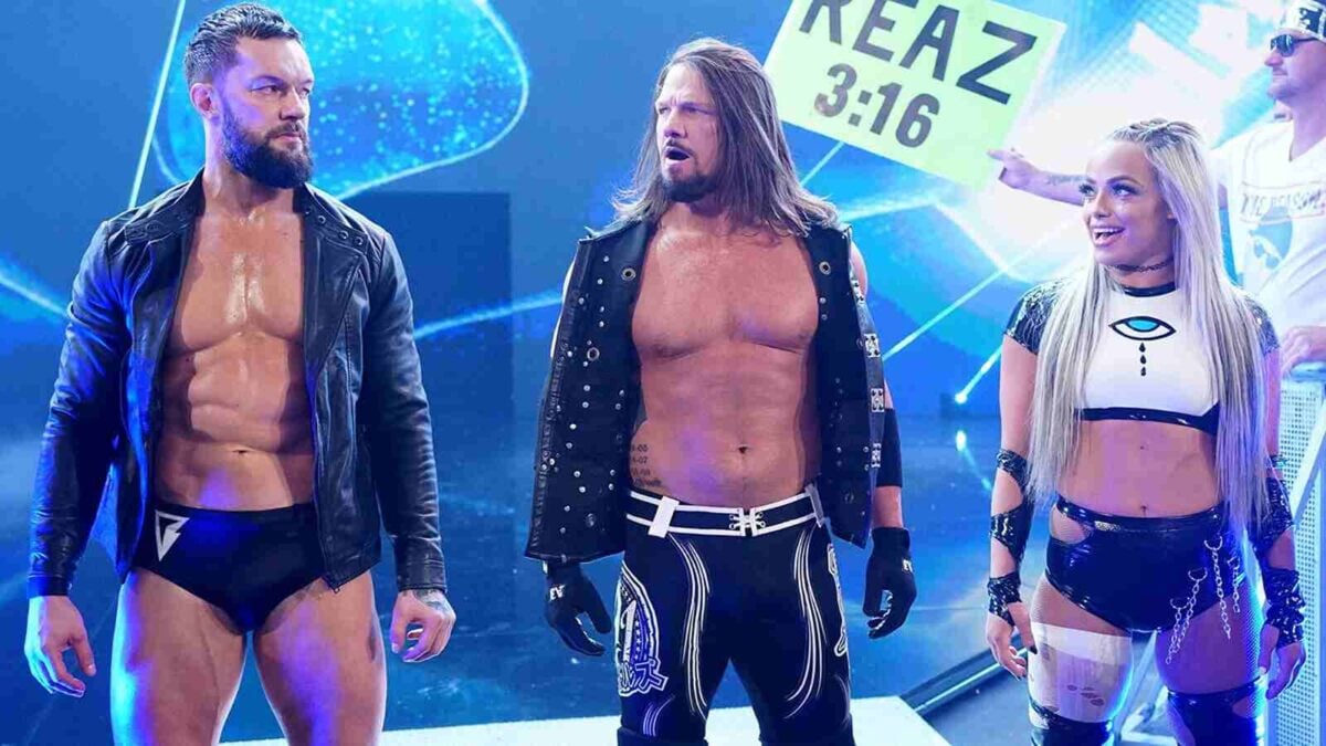 Finn Balor, AJ Styles, and Liv Morgan