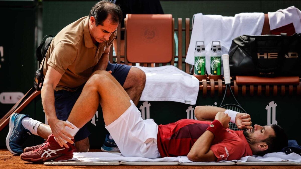 Novak Djokovic of Serbia receives medical treatment during the ninth day of Roland-Garros 2024