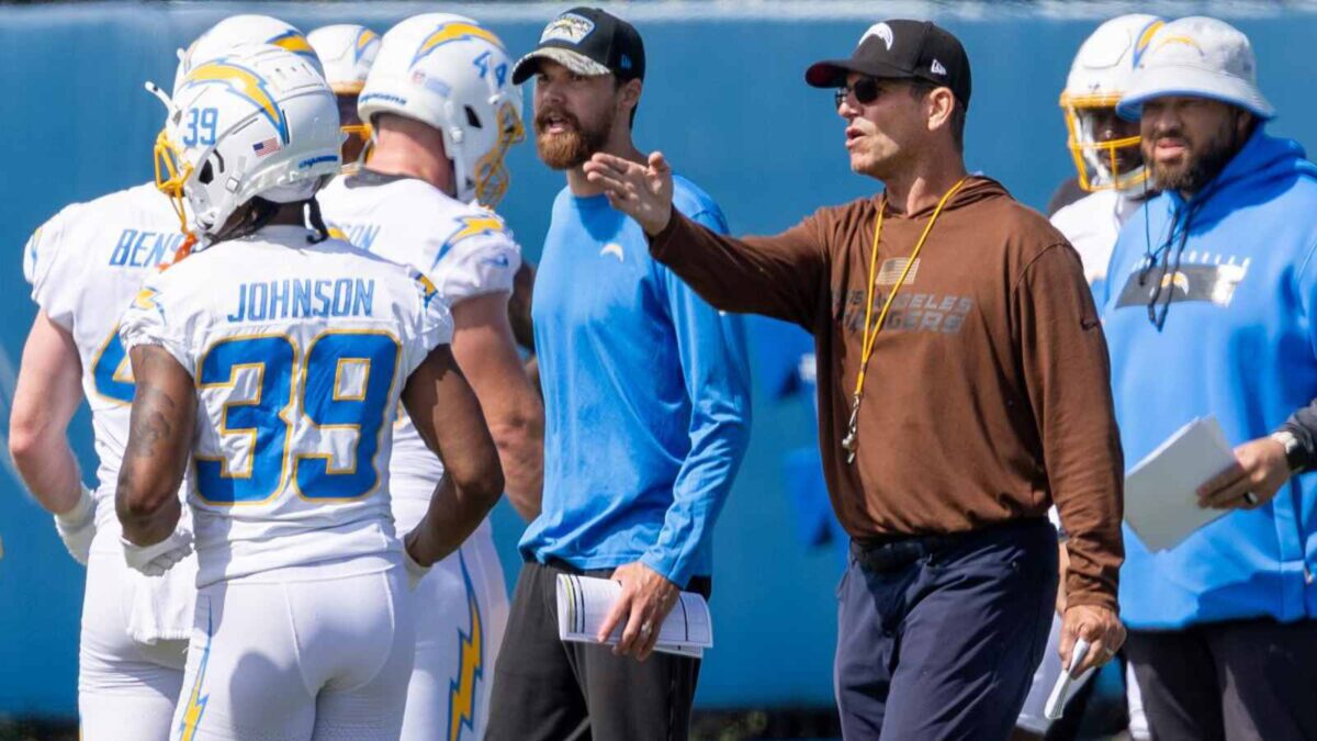 Chargers' HC Jim Harbaugh with his team