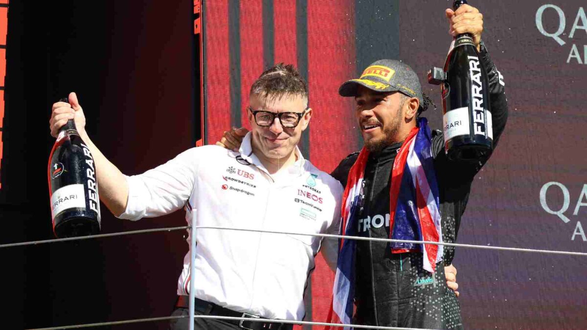 Mercedes' Lewis Hamilton and Peter Bonnington at the British GP podium