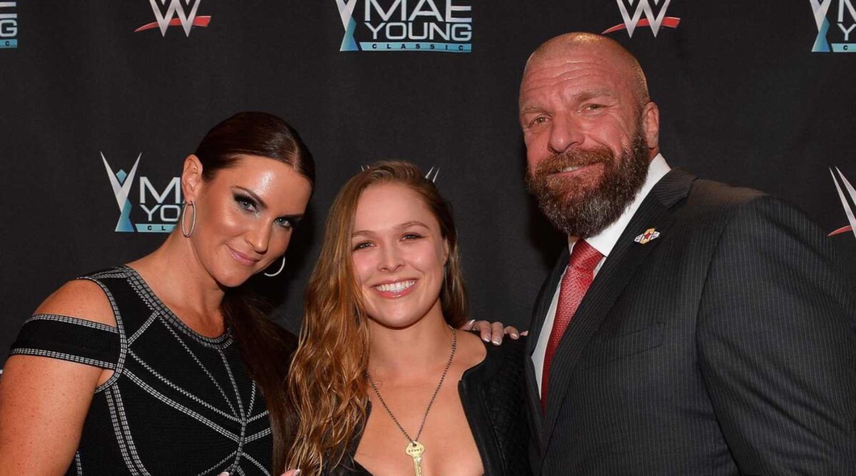 Stephanie McMahon, Ronda Rousey, and Triple H 