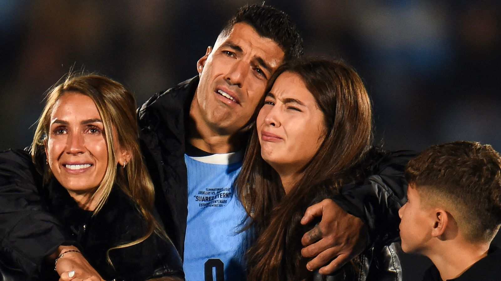 Luis Suarez in TEARS as family surrounds player after playing final game for Uruguay