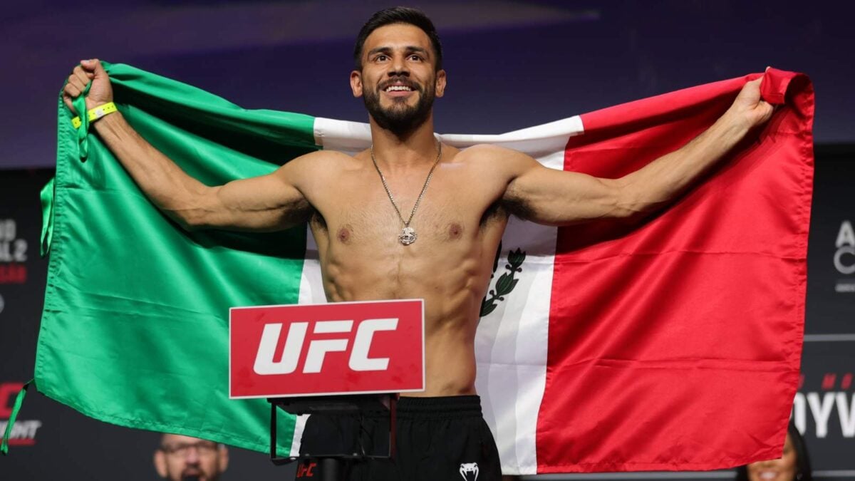 Yair Rodriguez holding the Mexican Flag