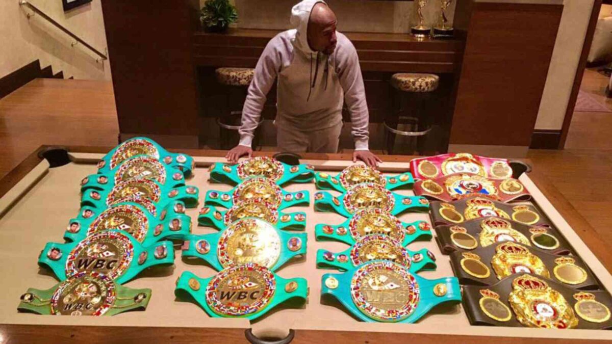 Floyd Mayweather flaunting his boxing championship belts