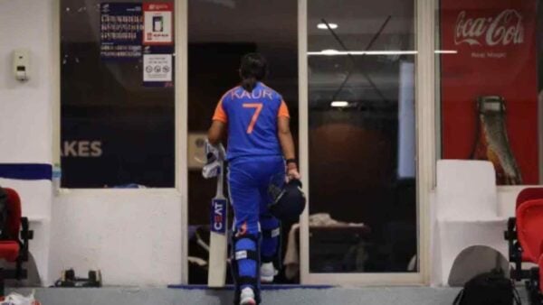 Harmanpreet Kaur walks back to the dressing room after the game