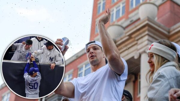 Two Yankees fans interfering with Los Angeles Dodgers' star Mookie Betts in World Series and Rob Gronkowski