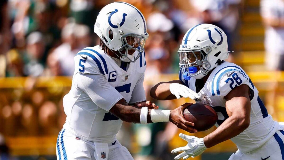 Colts Anthony Richardson receives words of encouragement from Vikings head coach Kevin O'Connell