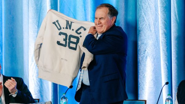 Bill Belichick shows his father's UNC sweatshirt at the Chapel Hill press conference