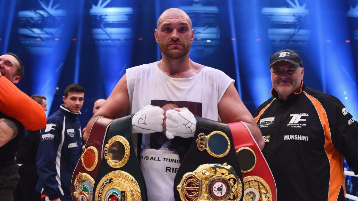 Tyson Fury with his belts